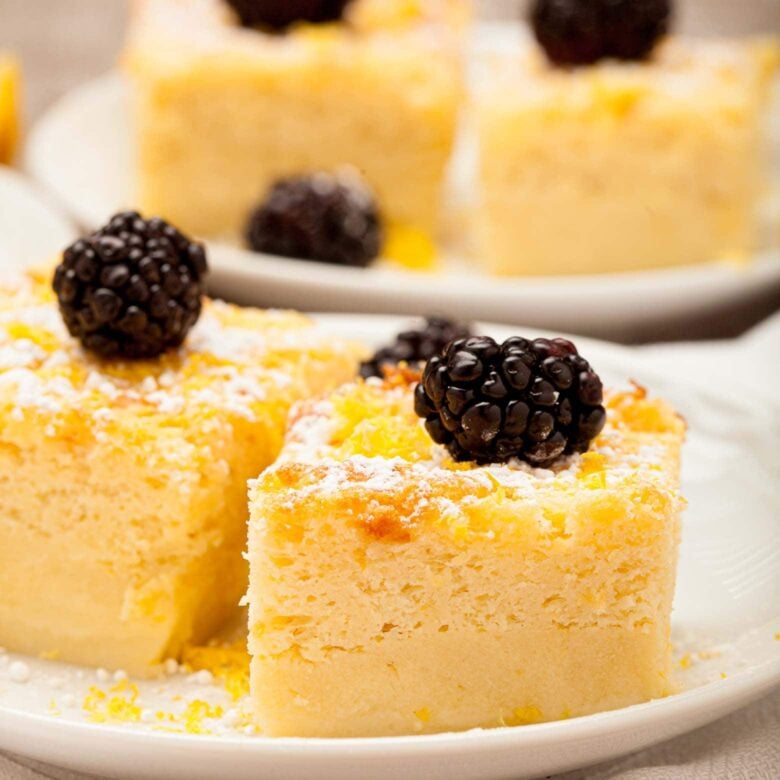 lemon custard cake plated and garnished close up.