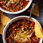 two bowls of lentil chili with black beans.