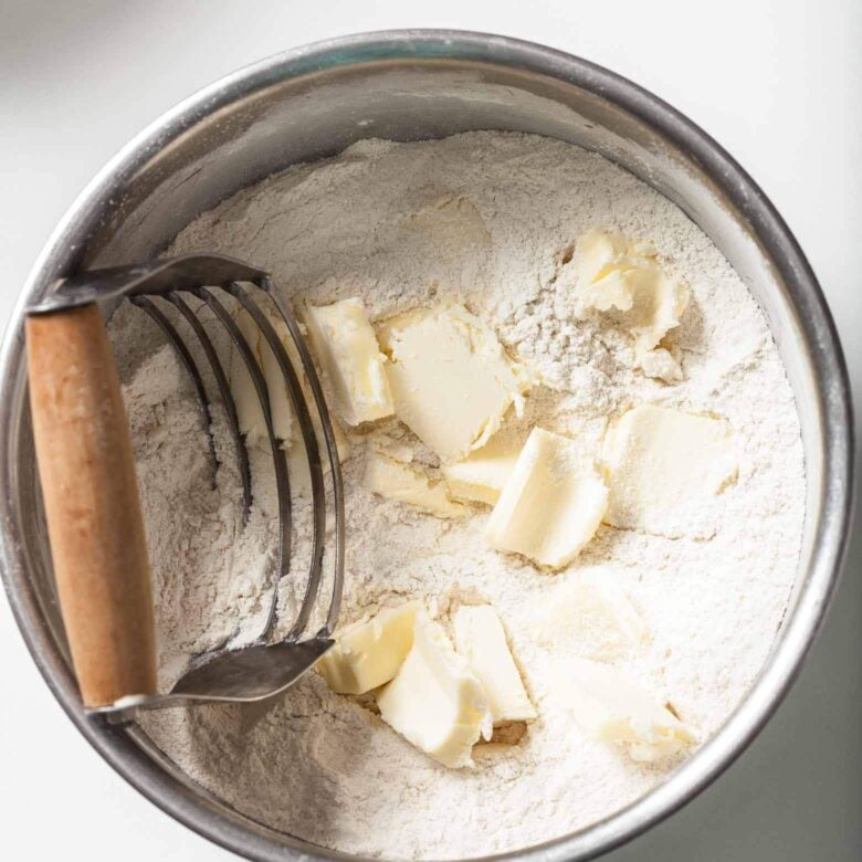 butter and flour mixture cutting in in a bowl.