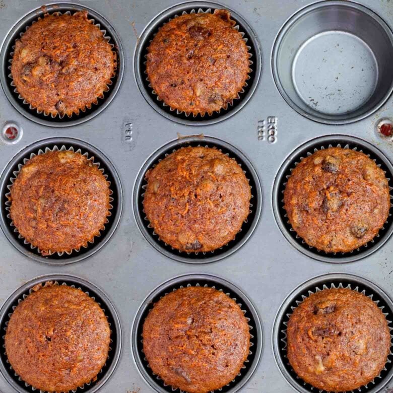 baked carrot cake cupcakes in muffin tin.