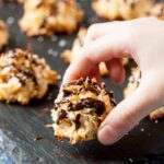 chewy coconut macaroons with chocolate drizzled on top.