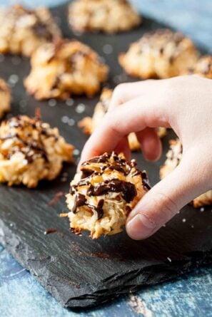 chewy coconut macaroons with chocolate drizzled on top.