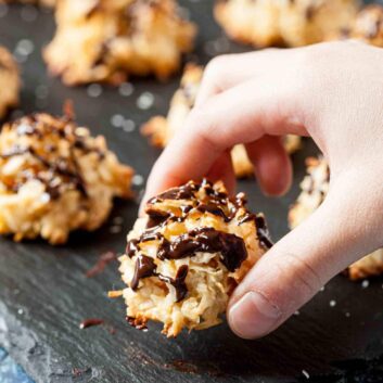chewy coconut macaroons with chocolate drizzled on top.