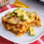 Easy enchilada casserole plated and garnished.