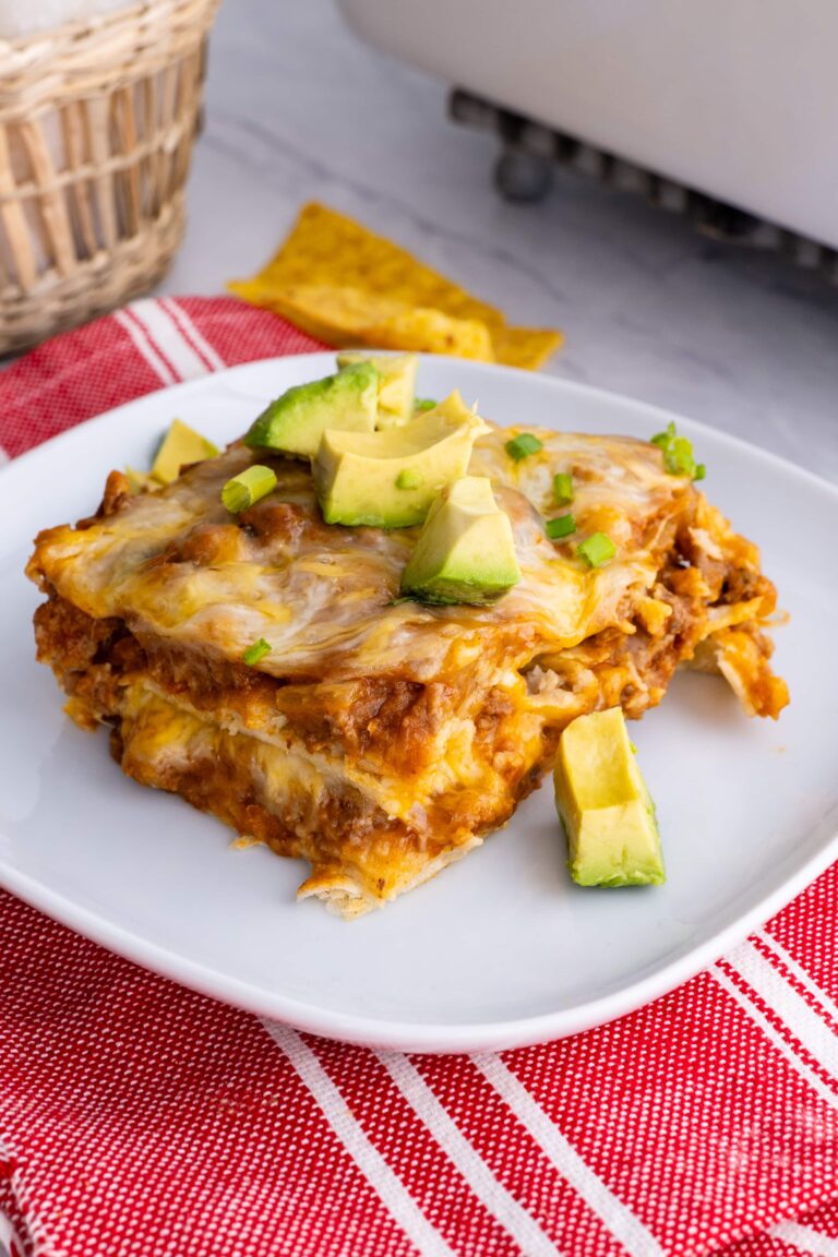 Easy enchilada casserole plated and garnished.