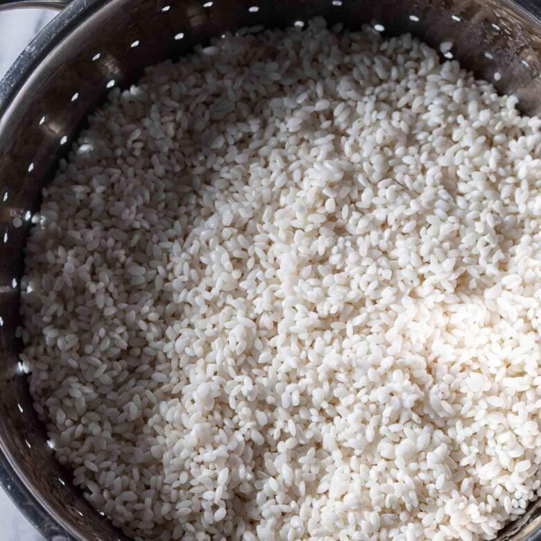 Rice for Chinese sticky rice in colander.