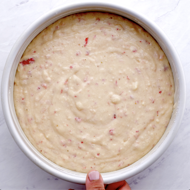 Fresh strawberry cake batter in a pan, ready to be baked.