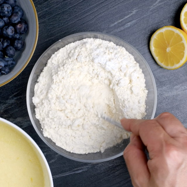 Dry ingredients being mixed to make lemon blueberry bundt cake.
