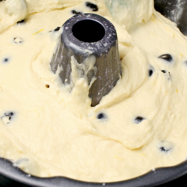 Lemon blueberry bundt cake batter in a bundt pan.