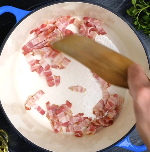 bacon bits sizzling in a pot