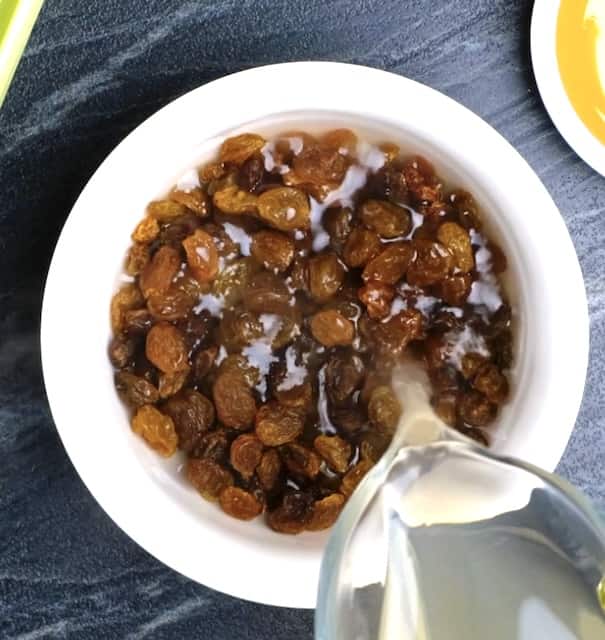 raisins plumping iin a bowl of water