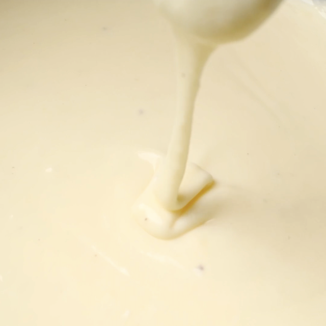 Creamy white cheddar sauce ready for mac and cheese.