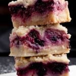 berry crumble bars stacked.
