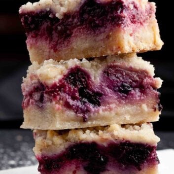 berry crumble bars stacked.