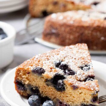 blueberry sour cream cake sliced and plated.