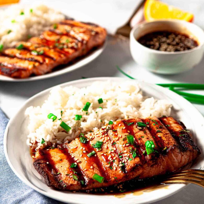 teriyaki salmon plated and garnished.