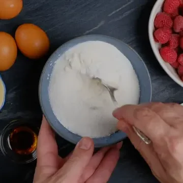 dry ingredients being mixed for easy raspberry cake.