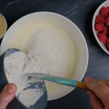 dry ingredients added to wet ingredients for easy raspberry cake.