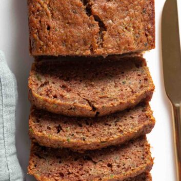 loaf of moist zucchini bread sliced.