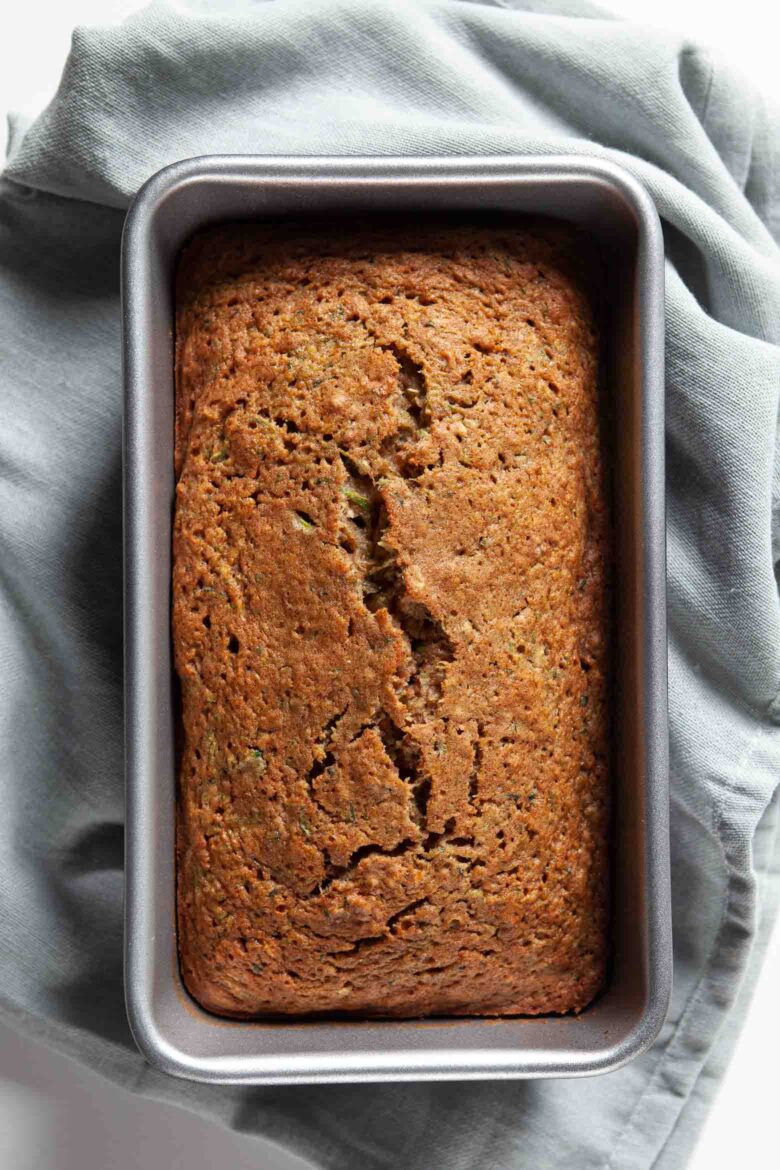 baked moist zucchini bread in loaf pan.