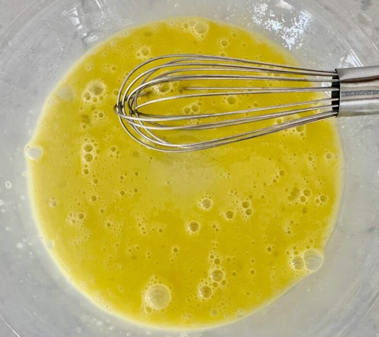 pan fried walleye egg wash in a bowl.