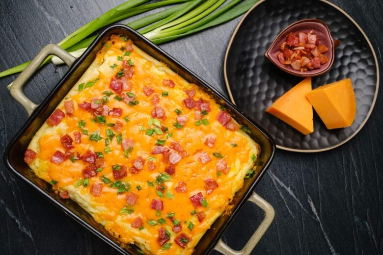 creamy baked mashed potatoes in a dish. 