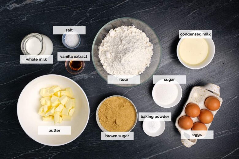 Overhead shot of ingredients to make brown sugar pound cake on a dark surface.