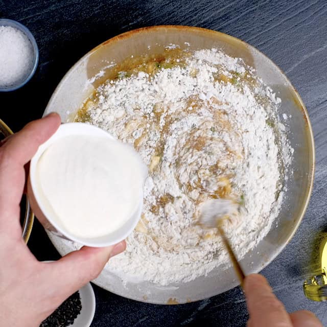 Dry and wet ingredients to make mochiko chicken recipe batter being mixed together in a bowl.
