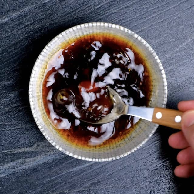 Optional dipping sauce for mochiko chicken being mixed in a bowl.