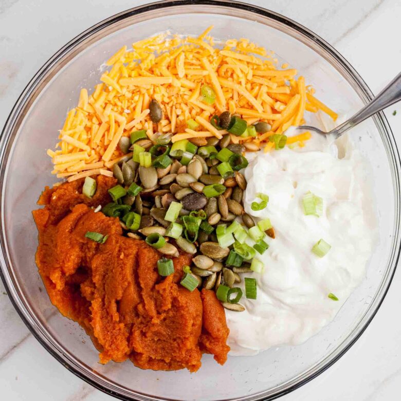 savory pumpkin dip ingredients in a bowl.