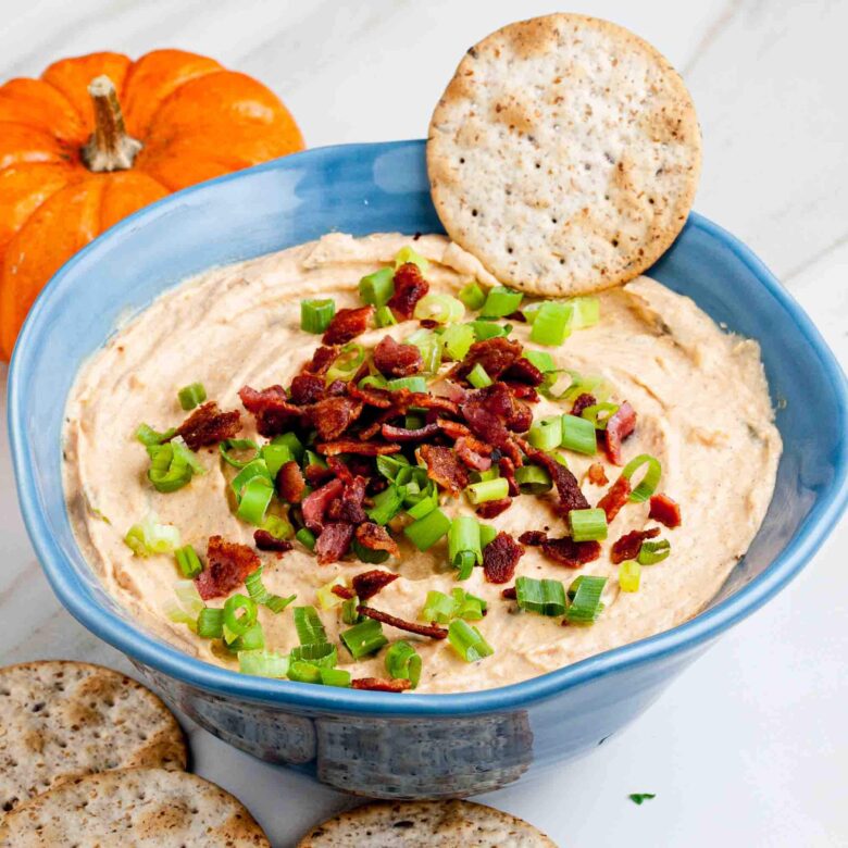 Savory Pumpkin Dip served in a bowl and garnished.