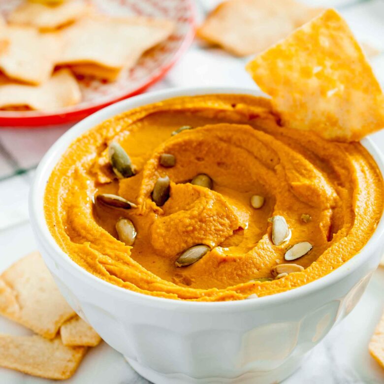 pumpkin hummus garnished with pepitas.