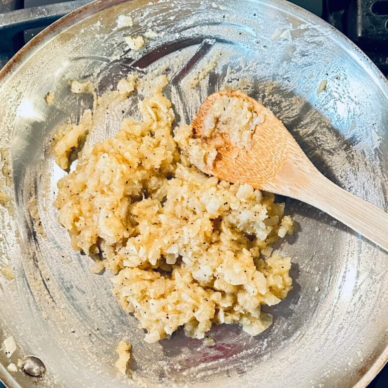 A thick roux being cooked in a pan to make turkey pot pie.