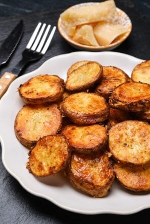 parmesan roasted potatoes on a plate.