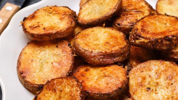 parmesan roasted potatoes on a plate.