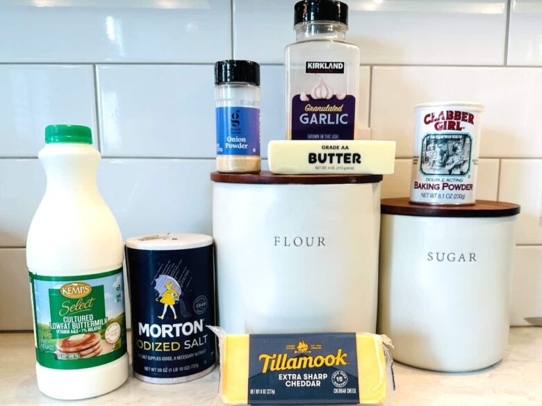 Ingredients to make cheddar bay biscuits on a white kitchen counter.
