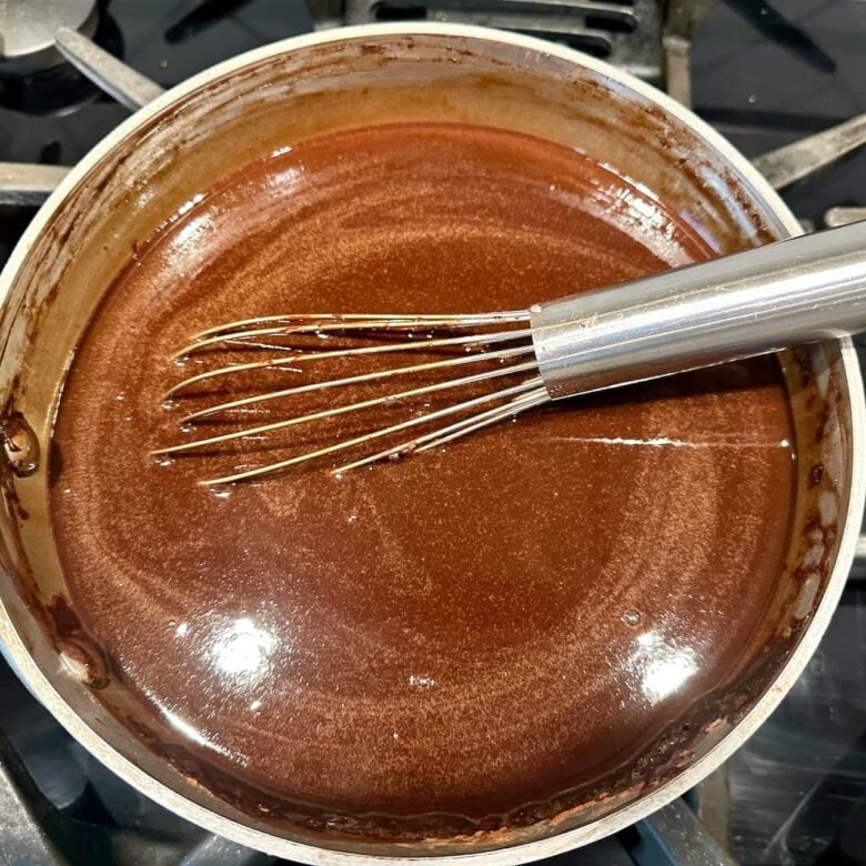 chocolate Bundt cake chocolate mixture dissolved in saucepan.