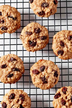 baked oatmeal raisin cookies on cooling rack.