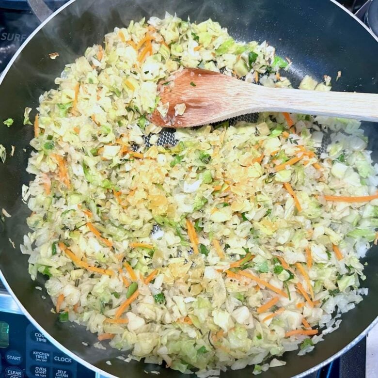 vegetables and onions in pan for wild rice pilaf.