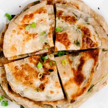 scallion pancakes sliced in quarters.