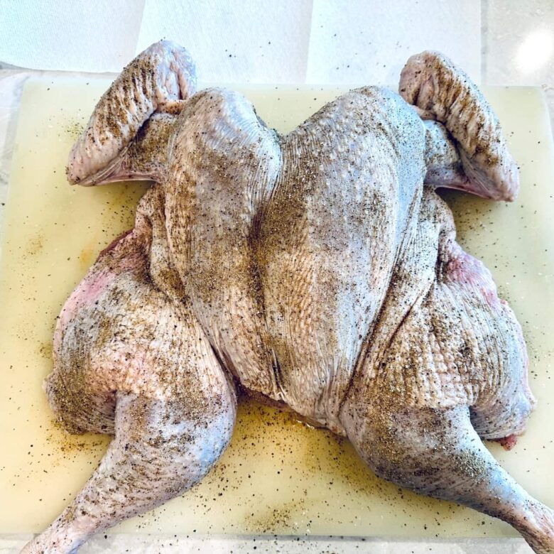 smoked spatchcock turkey with rub.