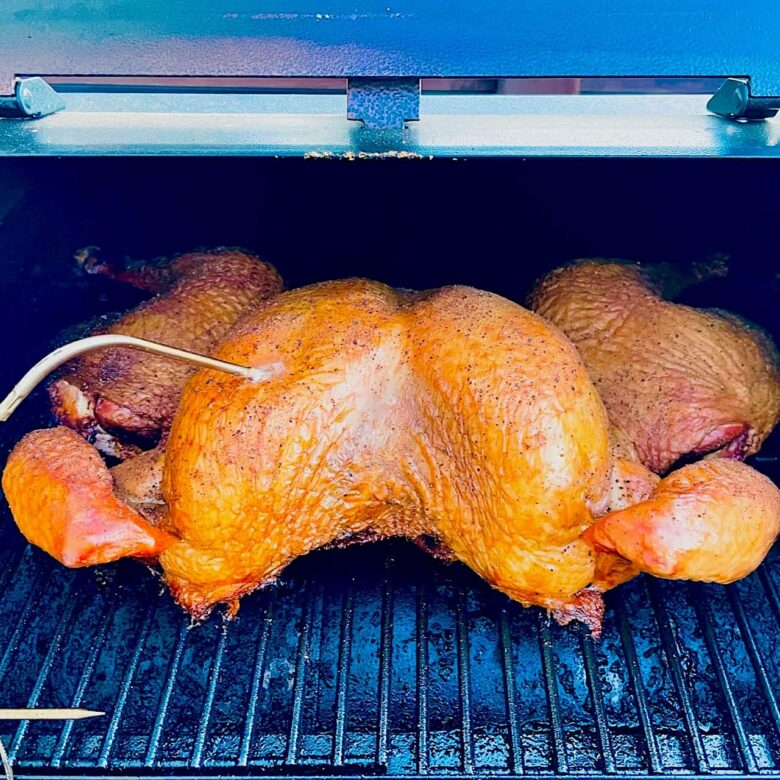 finished smoked spatchcock turkey in smoker.
