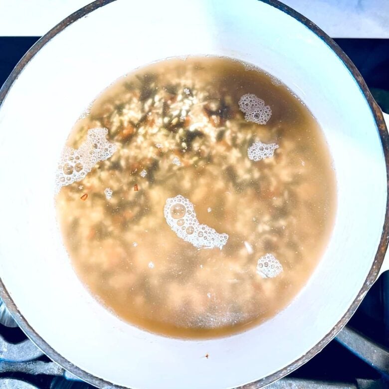wild rice in pot with water.