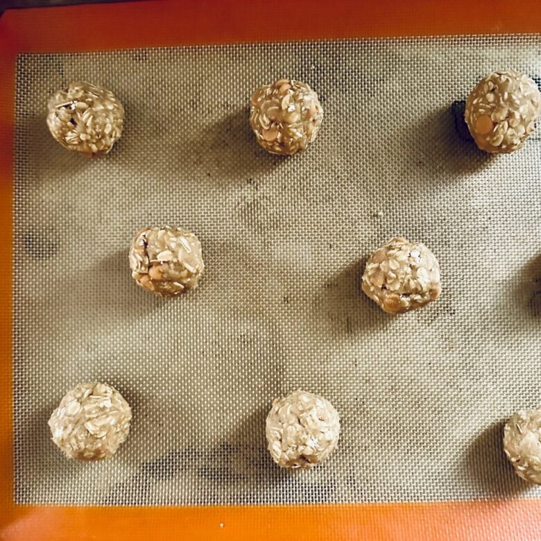 oatmeal butterscotch cookie dough balls on baking sheet.
