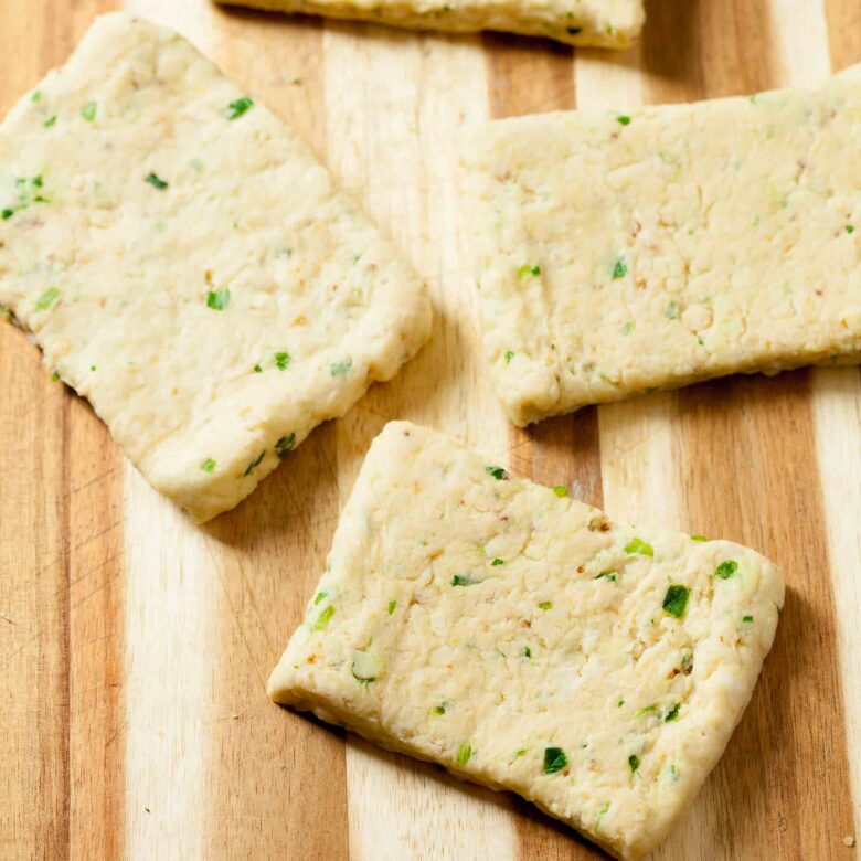 savory scones dough cut into rectangles.