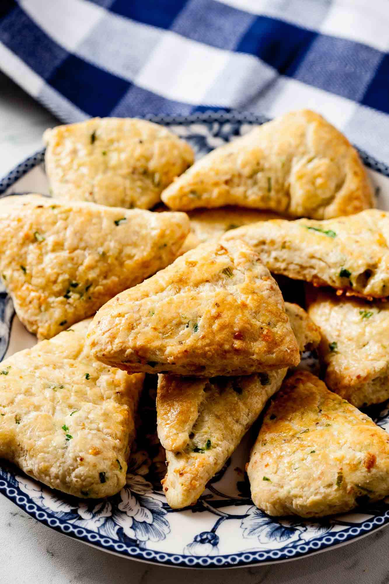 savory scones stacked on a plate.