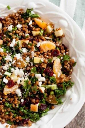 Overhead shot of Wheat Berry Salad on a white plate.