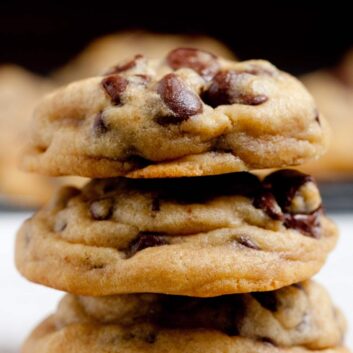 soft chocolate chip cookies piled 3 high.