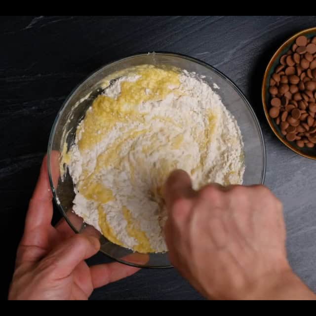 wet and dry ingredients combined for soft chocolate chip cookies.