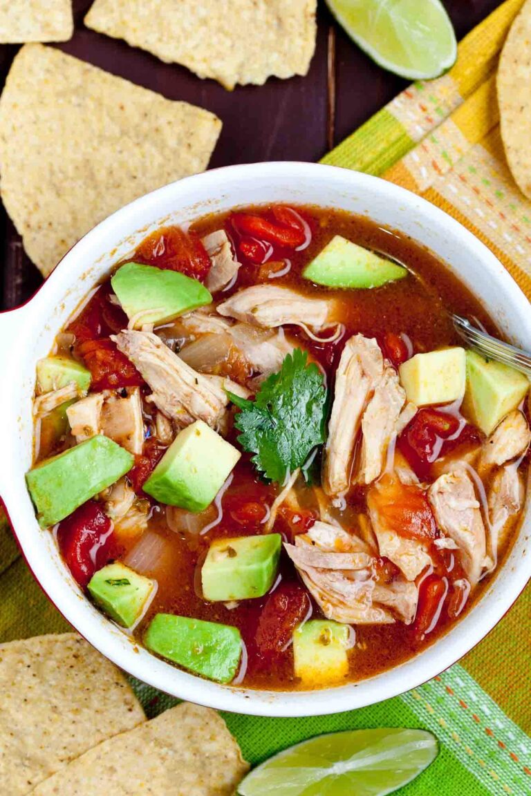 Overhead shot of a bowl of easy Mexican chicken dish with avocado chunks, tomatoes, cilantro, and chicken.